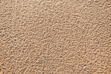 Beach sand background, natural texture, brown color, copy spaceの写真素材