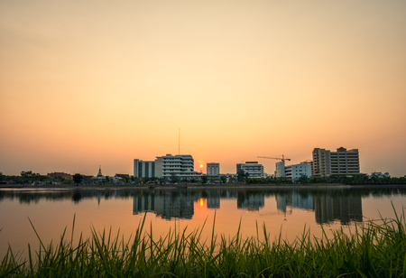 Beautiful sunset with lake and building in Public Parkの写真素材