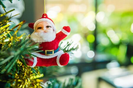 Close-up of Christmas-tree with decorations items in light and bokeh background, christmas and newyear festive conceptの写真素材