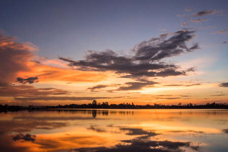 Colorful sky at sunset on the lake landscapeの写真素材