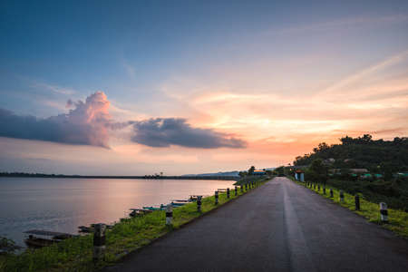 View of Road on the dam on sunsetの写真素材