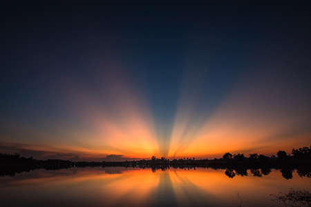 Colorful cloud and sky on sunset with lake landscapeの写真素材