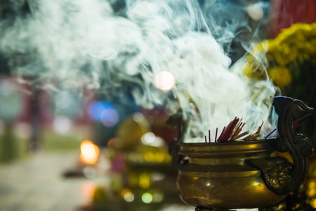 Burning incense in a chinese censerの写真素材