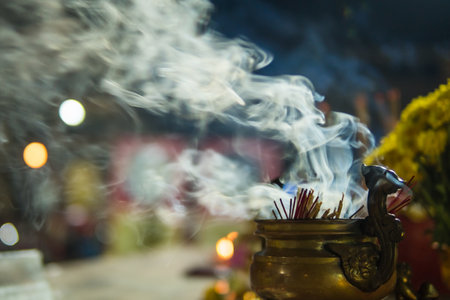 Burning incense in a chinese censerの写真素材