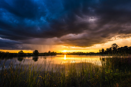 Beautiful landscape of the rain clouds on sunsetの写真素材