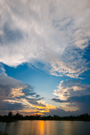 Beautiful sky at sunset at the lake in the park backgroundの写真素材