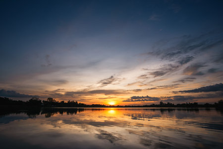 Beautiful sky at sunset at the lake in the park backgroundの写真素材