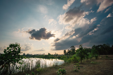 Beautiful sky at sunset at the lake in the park backgroundの写真素材