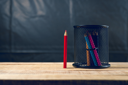 Red pencil from color group on wood tableの写真素材