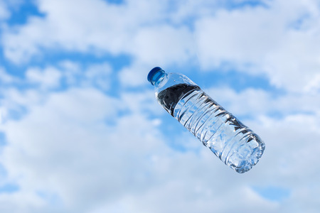 Water bottle with a clouded backgroundの写真素材