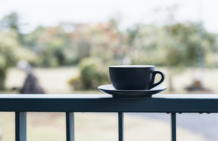 Hot coffee in a black cup, put on a steelの写真素材