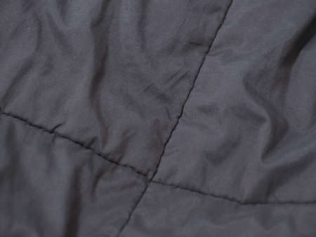 Soft dark brown background with wavy embossed jagged edges
