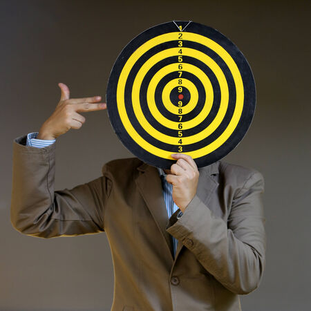 Business man has target on his head