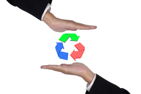 Conceptual image, help and care for recycling. Two hands isolated on white with recycle icon in the middle.の写真素材