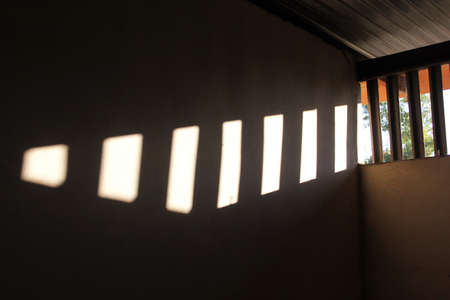 The sun shines through the window, in the morning light.の写真素材