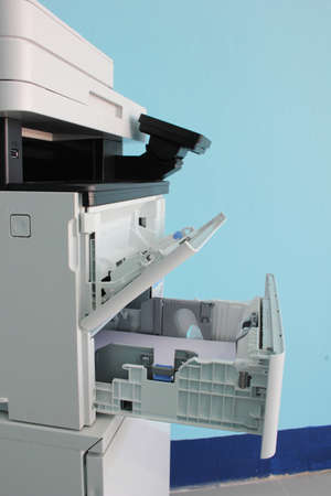 photocopier is a machine that makes paper copies of documents and other visual images ,close-up...