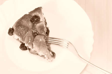 Eating a slice of crushed grapes, typical Italian cake, directly above sepia toneの写真素材