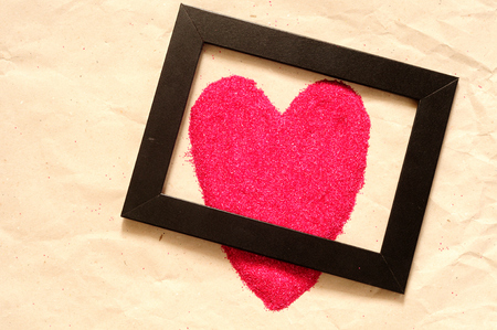 Red heart shaped, whit a black frame, backgroundの写真素材