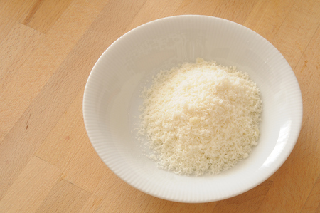 bowl of grated parmesan cheeseの写真素材