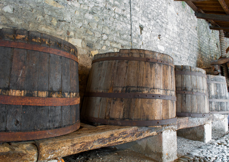 old wooden barrels for aging and storage of liquorの写真素材