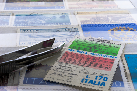 stamp collection of Italian post office handled with careのeditorial素材