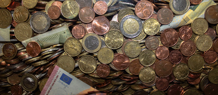 coins and notes fill a glass tank used for charity