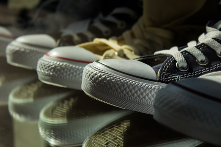 sneakers displayed in the window as if they were works of artの写真素材