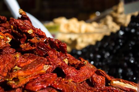 a cascade of excellent Italian sun-dried tomatoesの写真素材