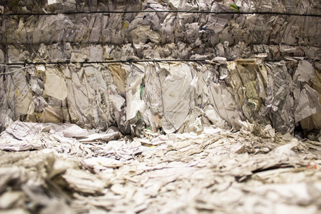 storage of paper pressed ready to be recycledの写真素材