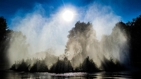 Fountain throws in heaven vaporized water to the delight of passersの写真素材