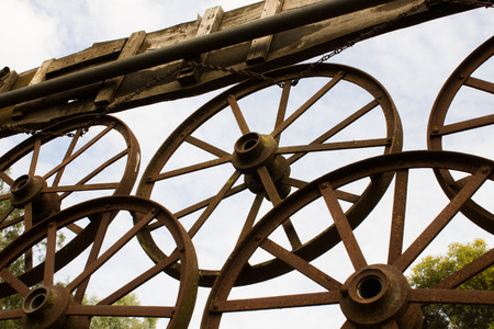 wagon wheels have become an ornament of the farmの写真素材