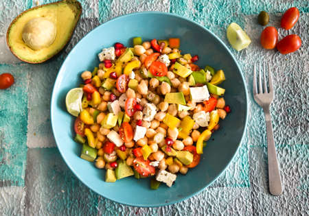 Top view of East Balela salad with chickpea, avocado, feta cheese, cherry tomato, onions. Mediterranean cuisine.の写真素材