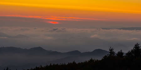 Sunrise seen from one of the peaks (Monte Falco) of the Apennine mountain range.の写真素材