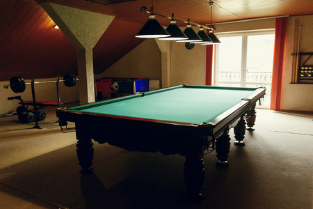 Luxury pool table at recreation room in rehabilitation centre in hospital, billiard hobby equipment...