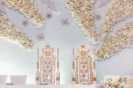 luxury decorated centerpiece for bride and groom with hydrangea and roses at rich wedding reception....
