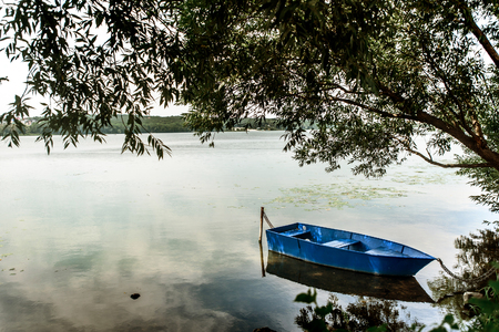 amazing view at old colorful wooden boat at sunny lake at the city, summer vacation conceptの写真素材