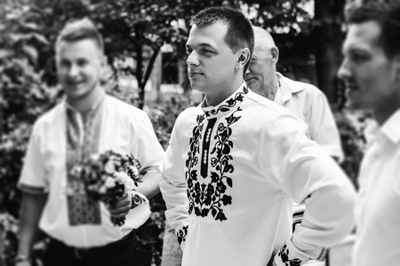 stylish groom with his best men waiting for a bride, wedding ceremony