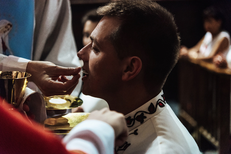 wedding ceremony of stylish elegant brunette bride and groom in the old churchの写真素材