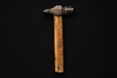 hammer, tool for repairing and renovation concept on black background top view. working instruments for repairing and fixing, flat lay, copy space. minimalistic image. father dayの写真素材