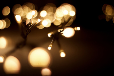 christmas garland lights at street in european city at winter seasonal holidays. decorations...