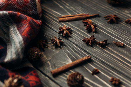 anise cinnamon on wooden rustic background. space for text. stylish winter or autumn wallpaper. cozy mood. seasonal holidays conceptの写真素材