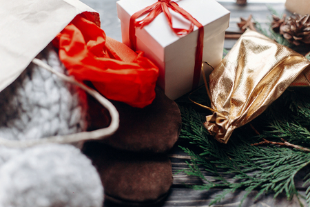 christmas shopping concept. big sale. seasonal rustic background with bags of buyed clothes presents. advertising with space for textの写真素材