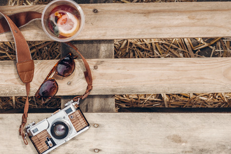 lemonade sunglasses camera on wooden background at summer street food festival flat lay. space for text. summer travel, wanderlust concept. hello summer vacation top view. hipster setの写真素材