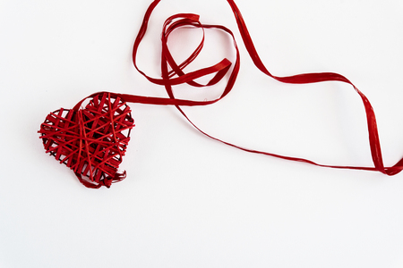 stylish red heart with ribbons, isolated on white background, valentines greeting card conceptの写真素材