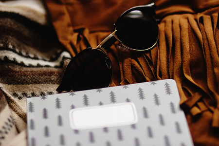 boho gypsy stylish elements of jacket fringe sunglasses notebook and camera, fashion set for travelの写真素材