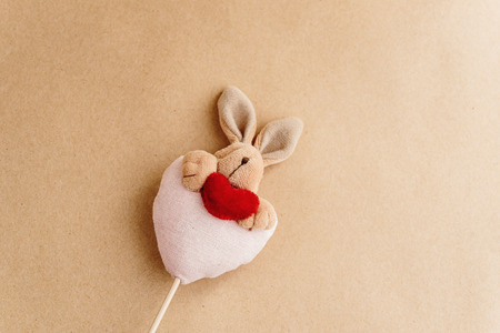 unique simple hand made bunny with heart on craft background, valentines day  and easter conceptの写真素材