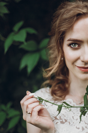 beautiful gorgeous bride with green leaves portrait. woman posing in beautiful nature outdoors. happy wedding couple  posing at old castle. happy marriage moments. elopement conceptの写真素材
