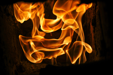 beautiful amazing view at burning fire flames at stone stove in room