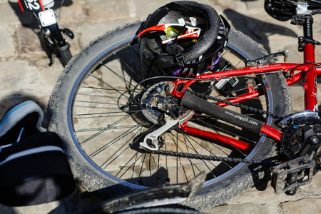 Lviv, Ukraine - May 6, 2017: cycling marathon VIII Lviv 100km ride, 425 bicycles, in the streets of the city. participants and athletes riding bikes. stylish red wheel and helmet close upのeditorial素材