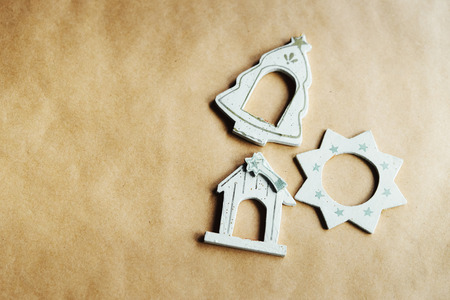 beautiful stylish vintage wooden toys, house, tree, star, christmas toys on wrapping craft paperの写真素材